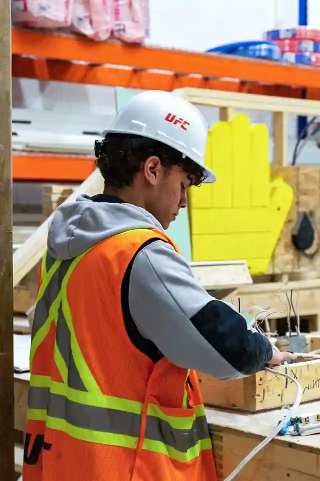 Construction team reviewing digital blueprints and project coordination on site